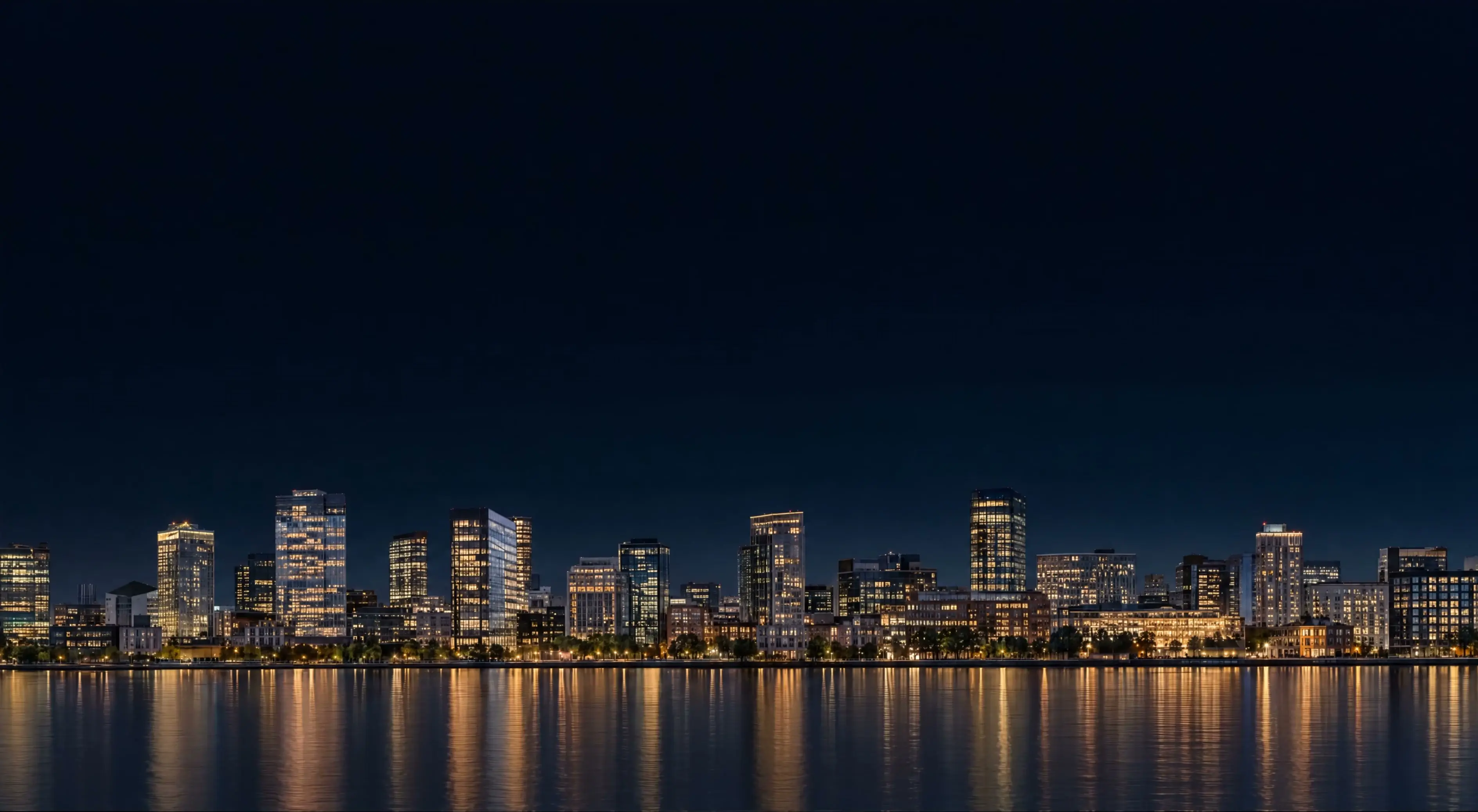A waterfront business district at night
